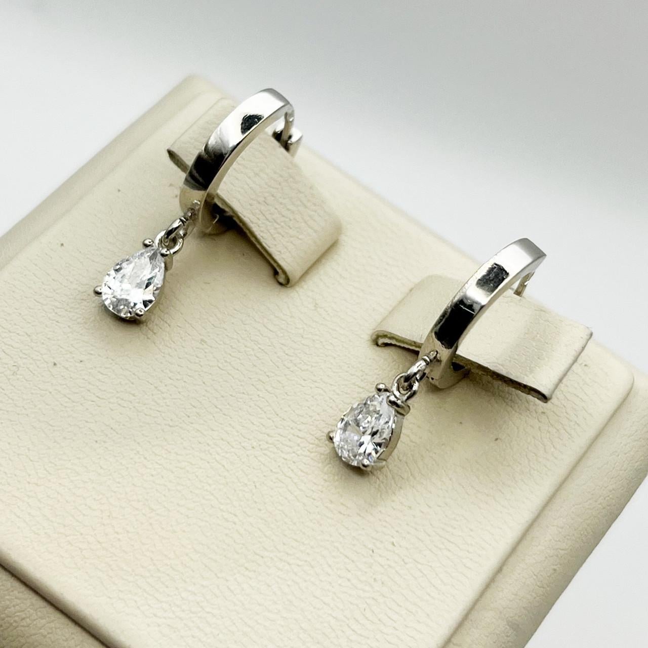 Серебряные серьги-кольца с кубическим цирконием 3,67 г (2449299541) Серебряные серьги-кольца с кубическим цирконием 3,67 г (2449299541)