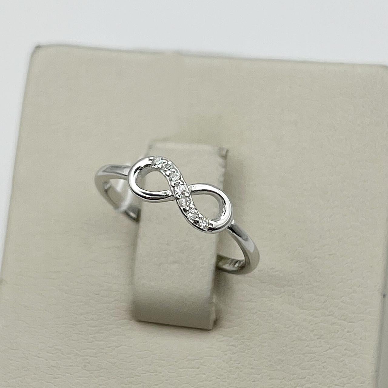 Кольцо серебряное Бесконечность с кубическим цирконием р. 15,5 0,91 г (2555953301) Кольцо серебряное Бесконечность с кубическим цирконием р. 15,5 0,91 г (2555953301)