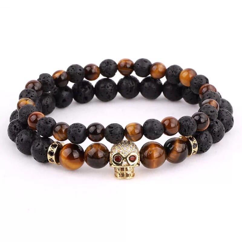 Комплект браслетів з лавового каменю та тигрового ока з золотим черепом р. 14 (12047)