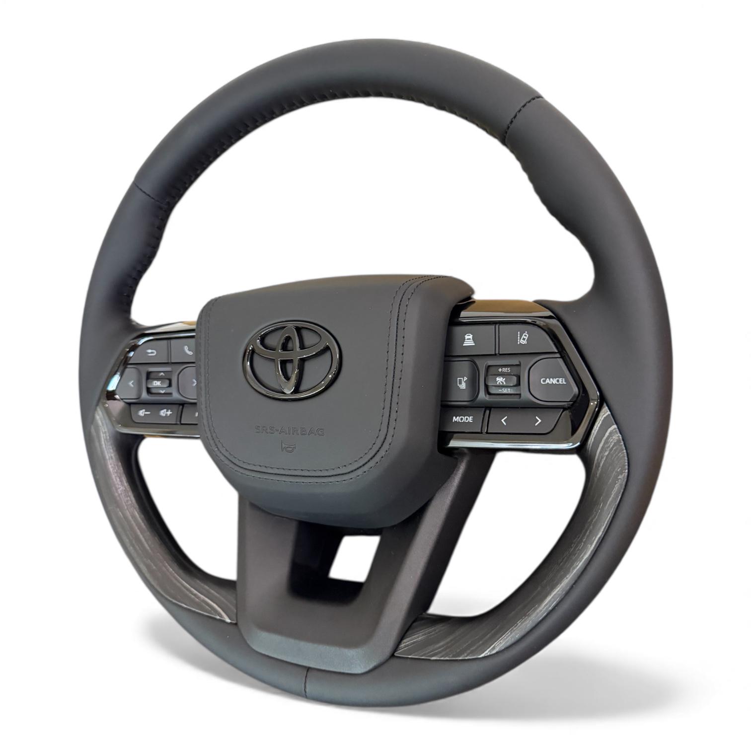 Руль для Toyota Land Cruiser 100/Prado 120 в стиле LC300 из кожи черный логотип в сборе Дерево (31181287)