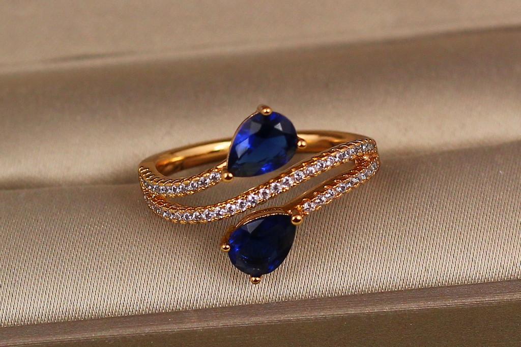 Каблучка Xuping Jewelry Зустрічні краплі із синіми каменями р. 18 Золотистий