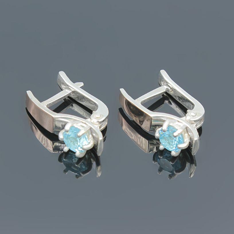 Серебряные серьги Хай-тэк с золотыми вставками и голубым фианитом