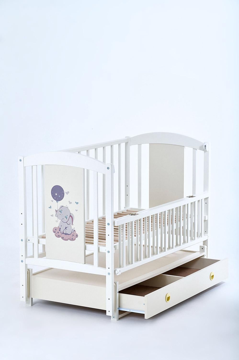 Кроватка для новорожденных деревянная Лилия бук с маятником/откидная боковина/ящик 120-60 см Ivory (Kuz64)