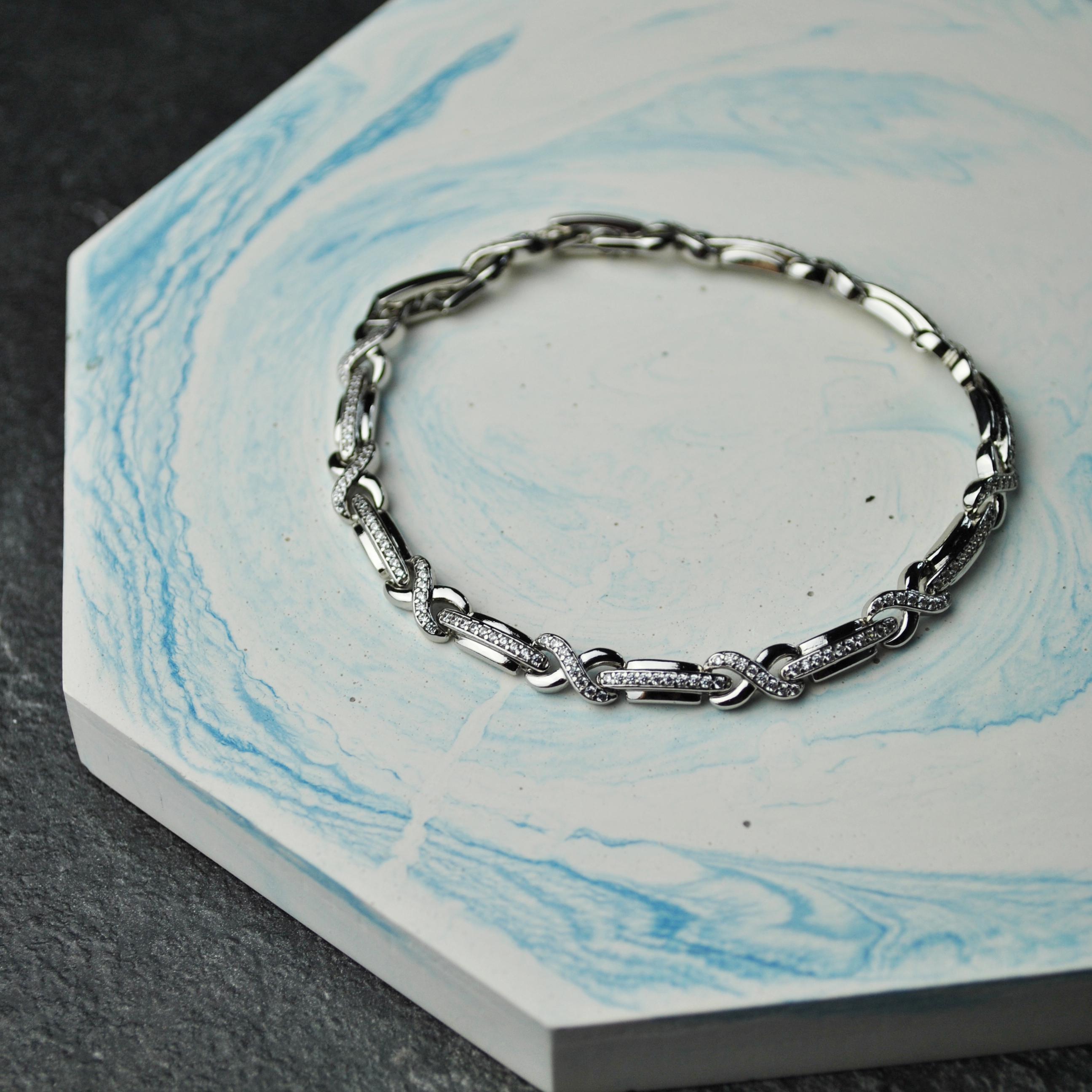 Браслет бесконечность с фианитами медицинская сталь родий (x188)