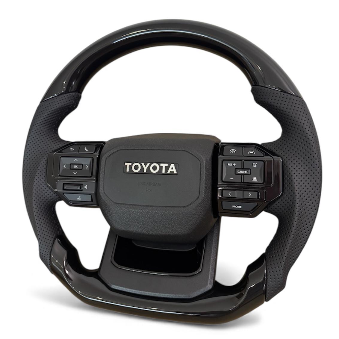 Руль анатомический для Toyota Land Cruiser 100/Prado 120 в стиле Prado 250 логотип хром (30583885) - фото 2 Руль анатомический для Toyota Land Cruiser 100/Prado 120 в стиле Prado 250 логотип хром (30583885) - фото 2