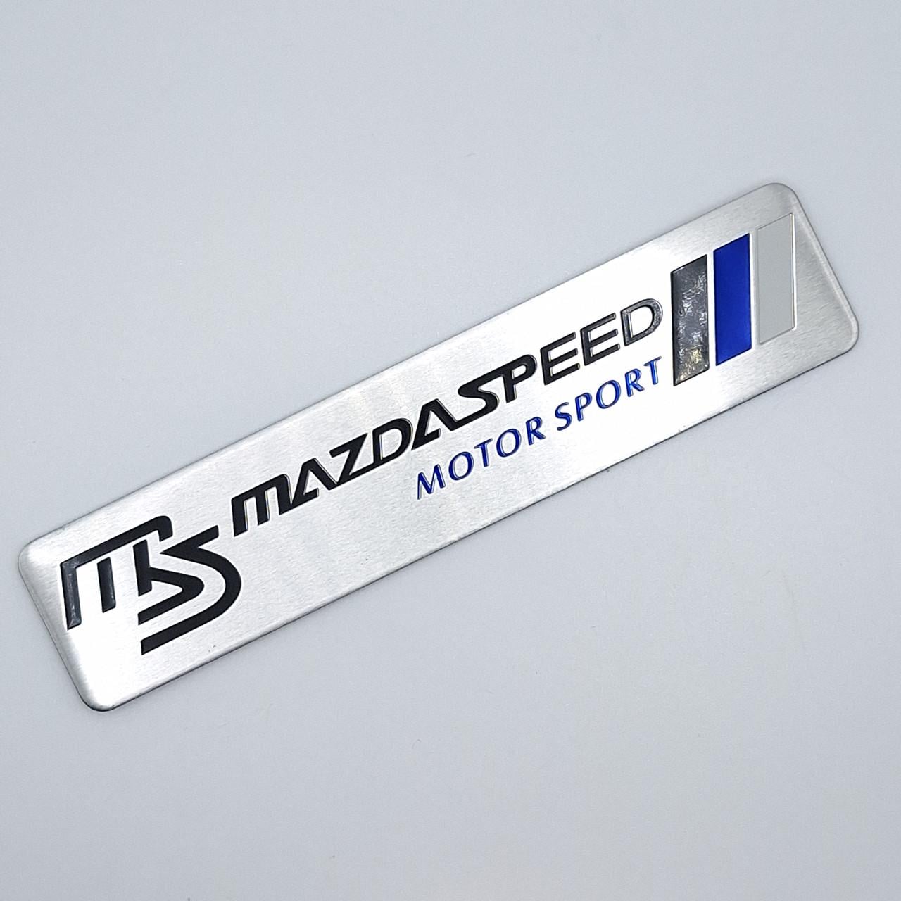 Эмблема алюминиевая MazdaSpeed motor sport Mazda 12х2,6 см (1969434132)