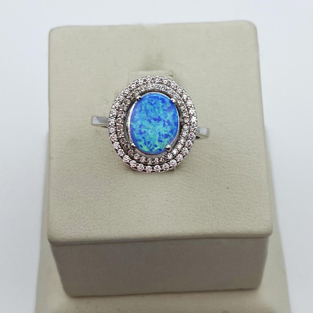 Кольцо серебряное с голубым опалом р. 17 3,12 г (1996071499)