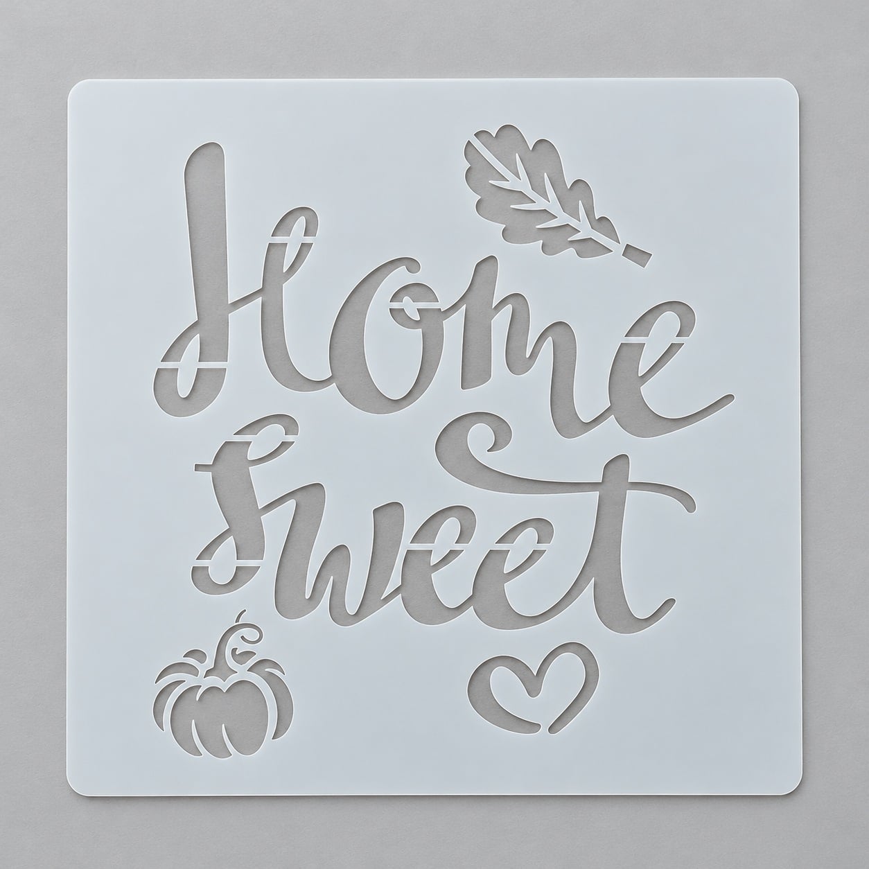 Трафарет на Хелловін з написом Home Sweet гарбузом серцем та осіннім листям для декорування торта 15x15 см Сірий (218104) Трафарет на Хелловін з написом Home Sweet гарбузом серцем та осіннім листям для декорування торта 15x15 см Сірий (218104)