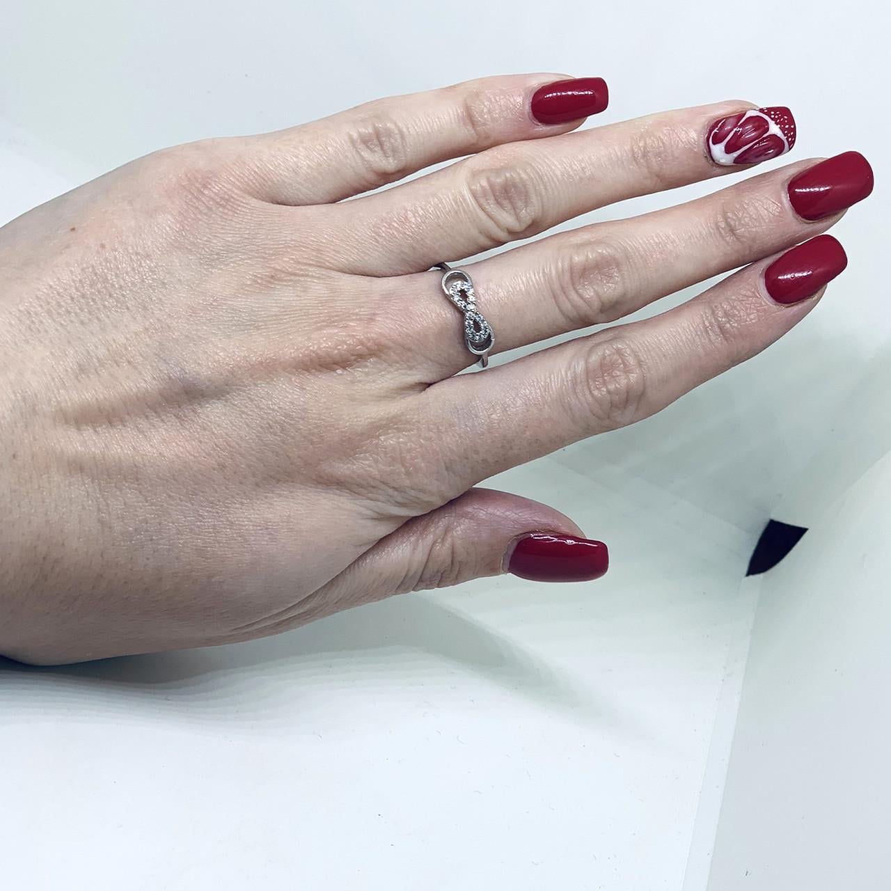 Кольцо серебряное Бесконечность с кубическим цирконием р. 17,5 1,75 г (1547201403)