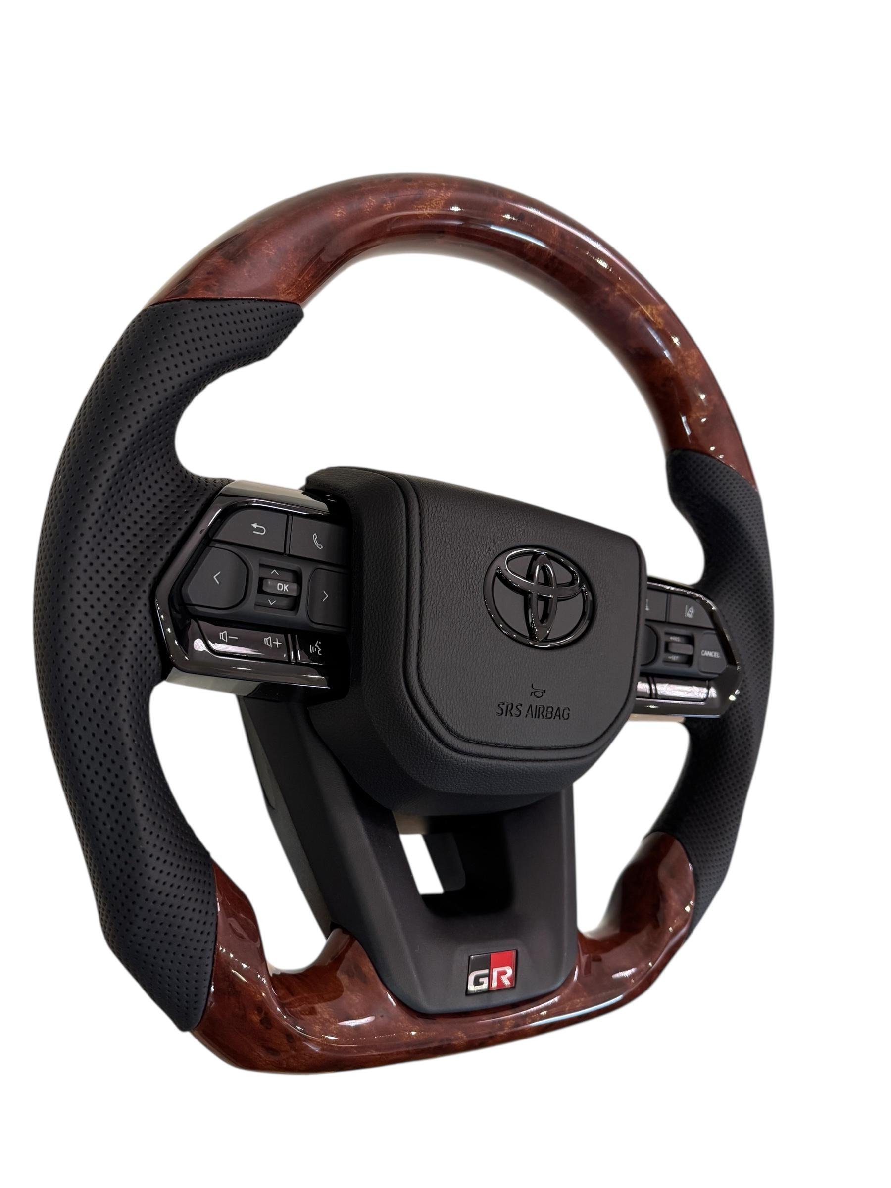 Кермо для Toyota Land Cruiser 100/Prado 120 GR під оригінальний колір салону в сборі зі скошеним низом логотип чорний глянець (30246663) - фото 2