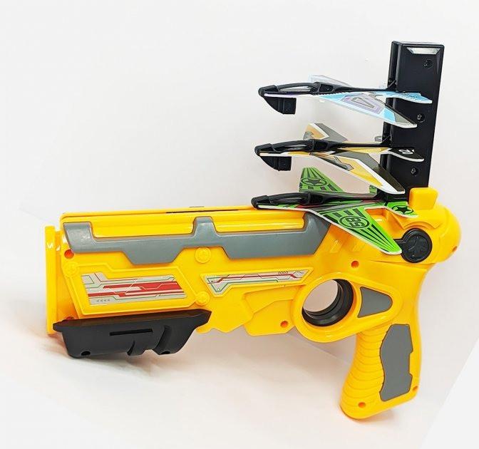 Детский пистолет игрушечный A-Toys стреляет самолетами (331-8A) Детский пистолет игрушечный A-Toys стреляет самолетами (331-8A)