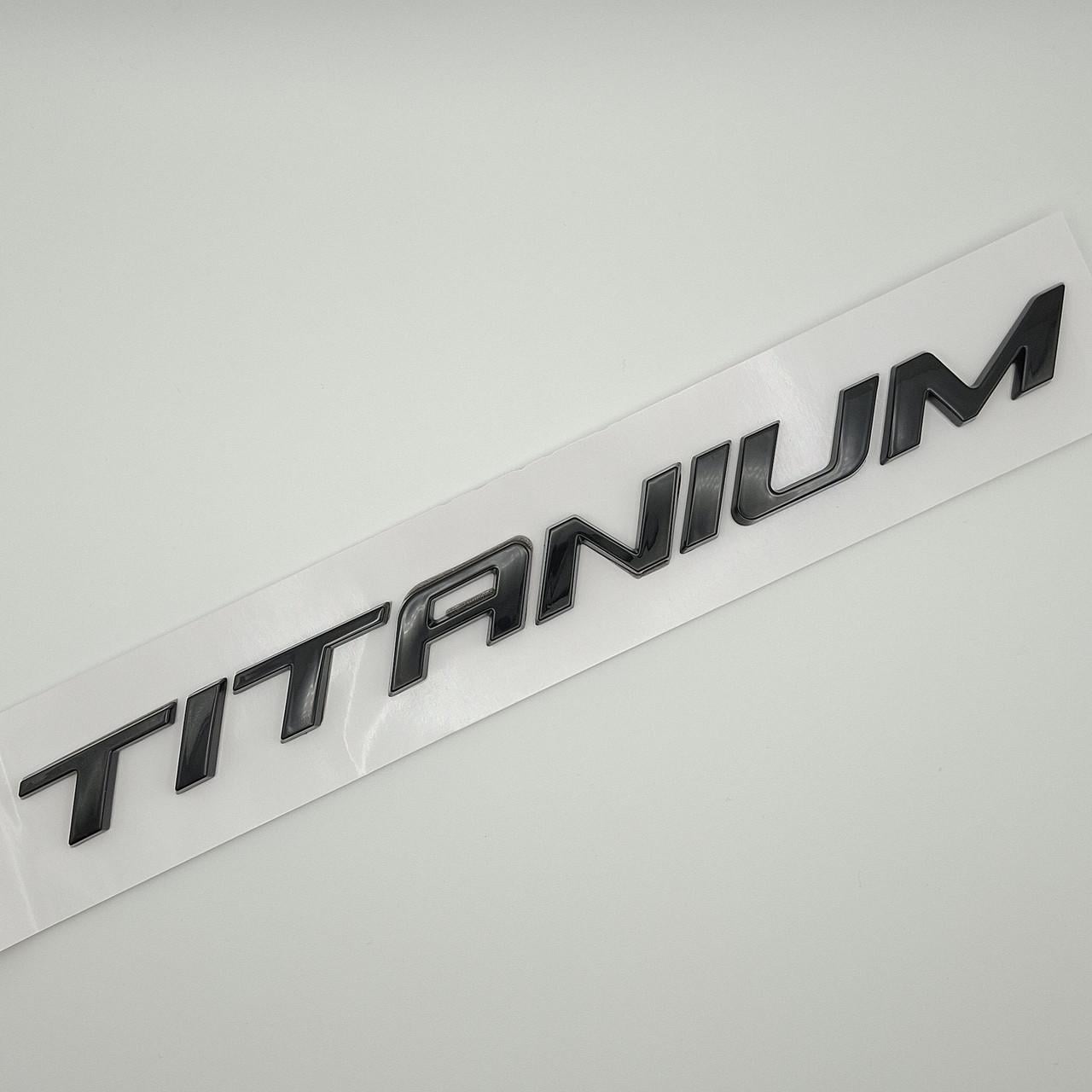 Эмблема надпись Titanium Ford ABS 22х1,5 см Черный глянцевый (2600782079)