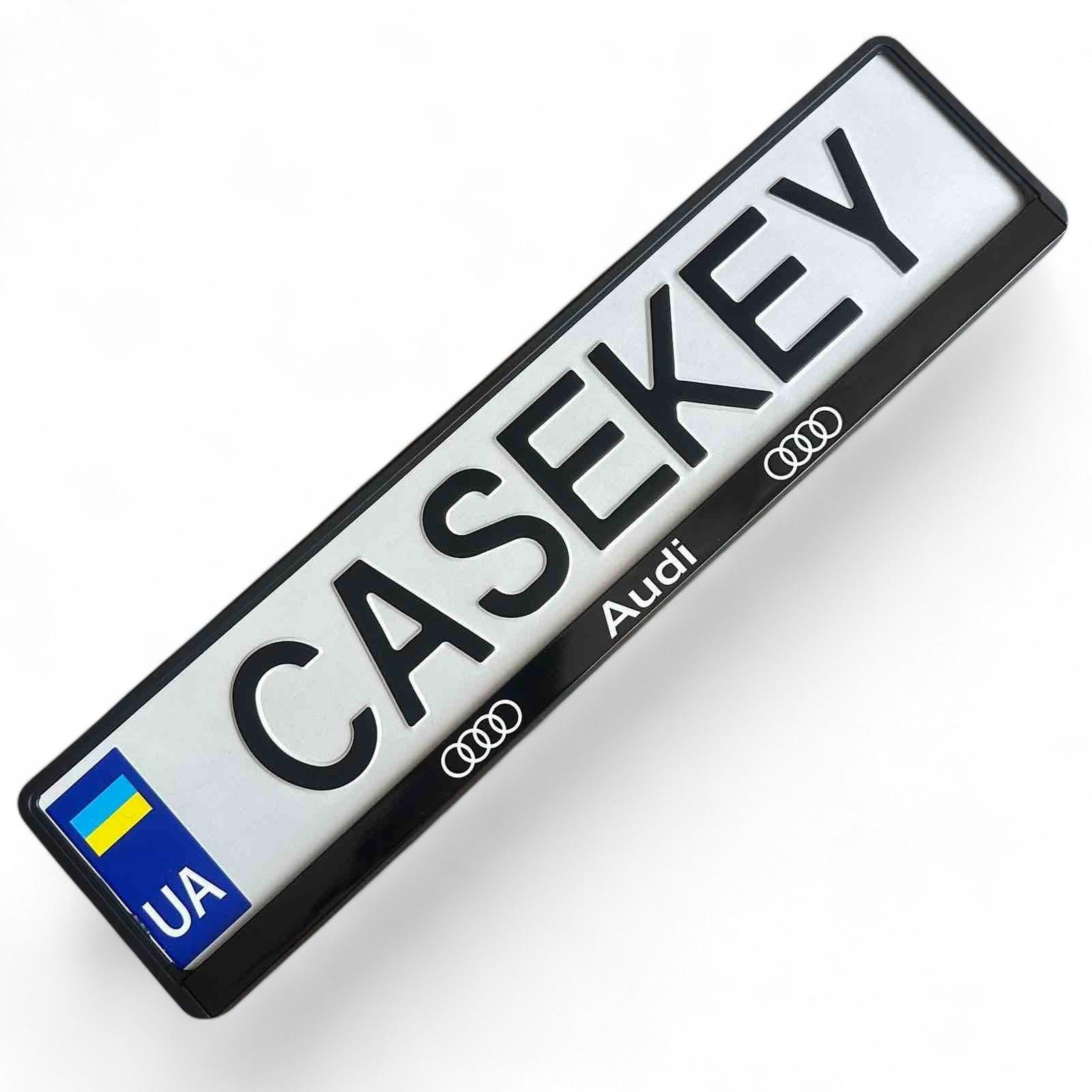 Рамка номерного знака Audi з лакованим друком (31937353) Рамка номерного знака Audi з лакованим друком (31937353)