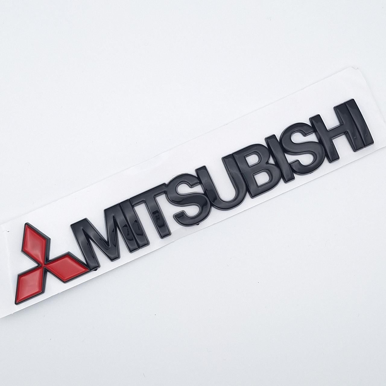 Эмблема надпись Mitsubishi ABS 15х2,7 см Черный глянцевый (2503558881)