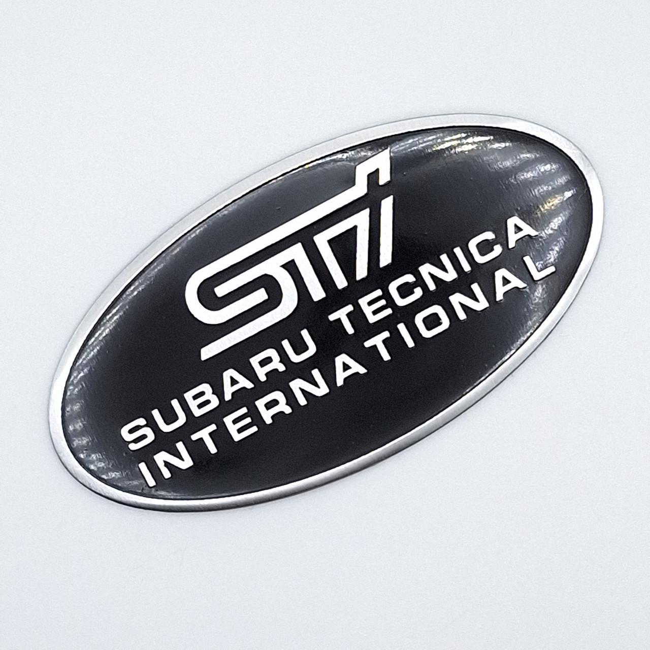 Эмблема алюминиевая SUBARU STI Subaru tecnica international 8,5х4,2 см Черный (1094099602)