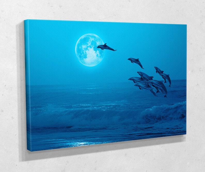 Картина для интерьера Дельфины над водой 51x34 см (714)