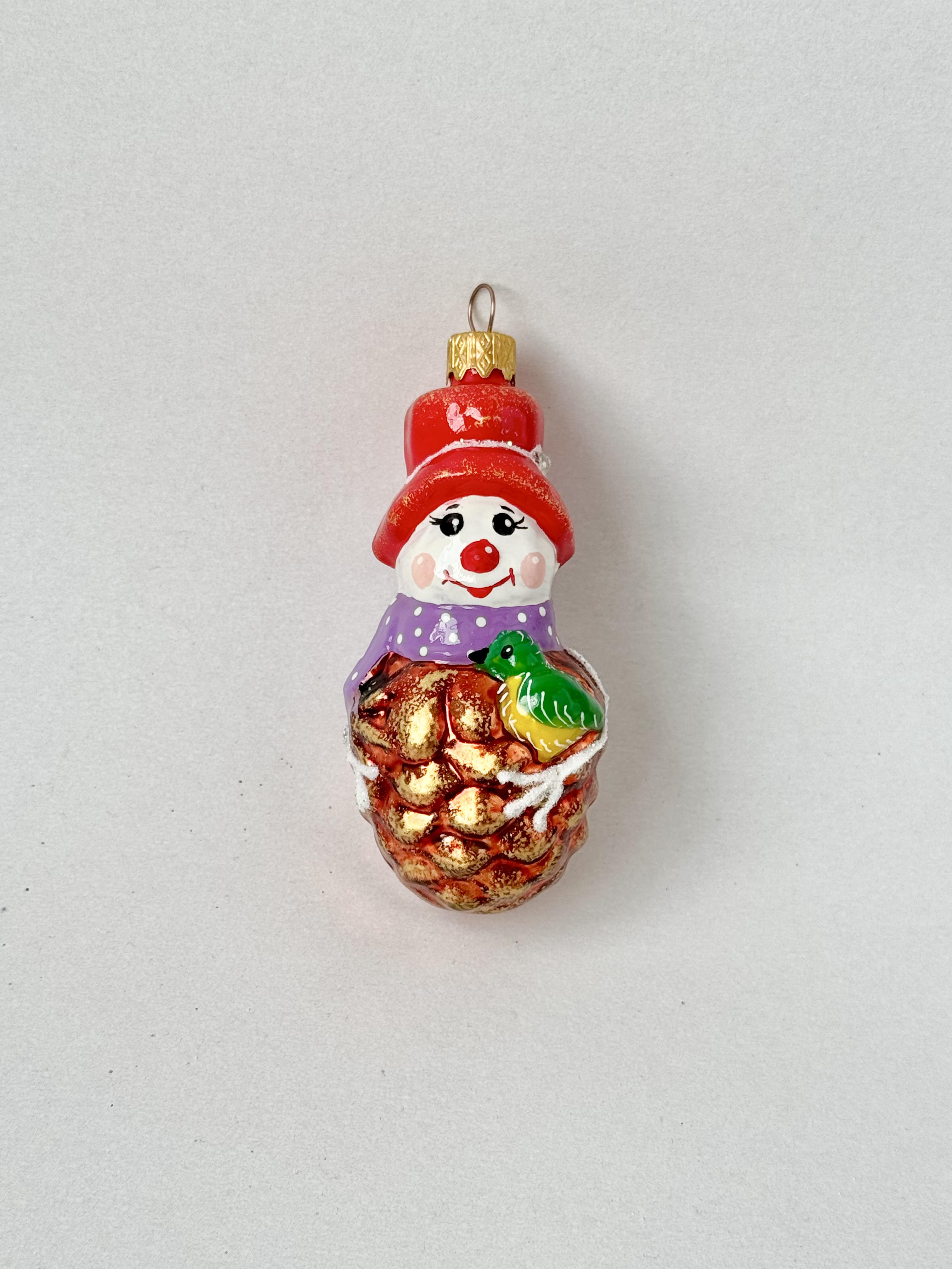 Игрушка на елку стеклянная Снеговик-шишка 10х5 см (F-232-2) Игрушка на елку стеклянная Снеговик-шишка 10х5 см (F-232-2)