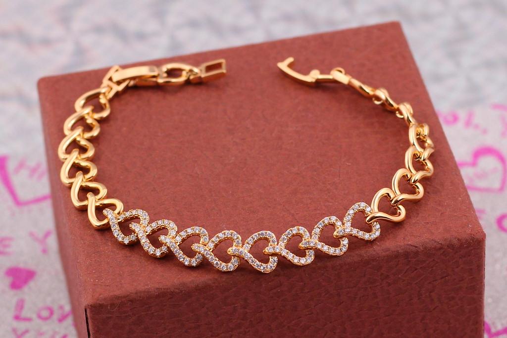 Браслет Xuping Jewelry Соединения сердца с фианитами 17,5 см 10 мм. Золотистый (1649347051)