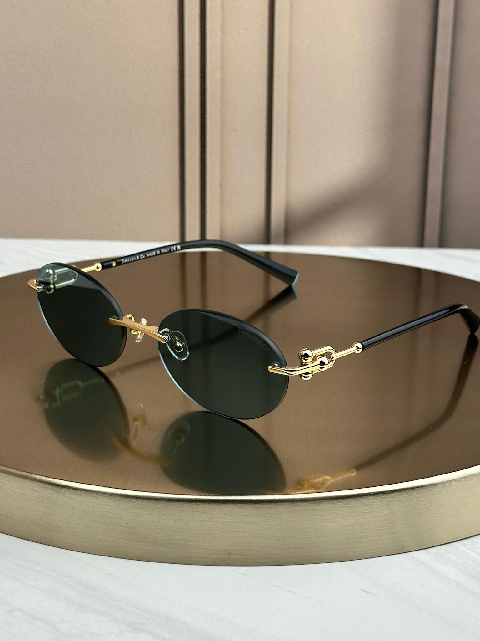 Солнцезащитные очки Tiffany & Co TF3104D безоправные овальные голубые линзы женские Золотой Черный Солнцезащитные очки Tiffany & Co TF3104D безоправные овальные голубые линзы женские Золотой Черный