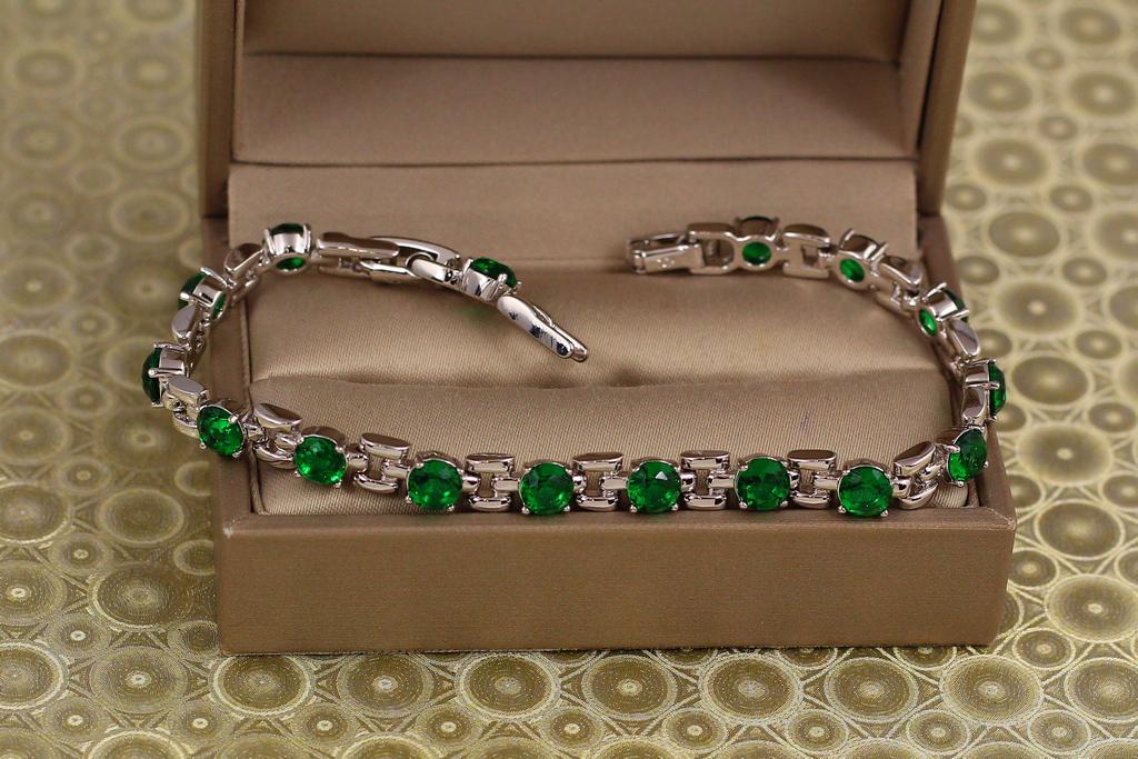 Браслет Xuping Jewelry Рапсодия с зелеными камнями 17 см 6 мм серебристый