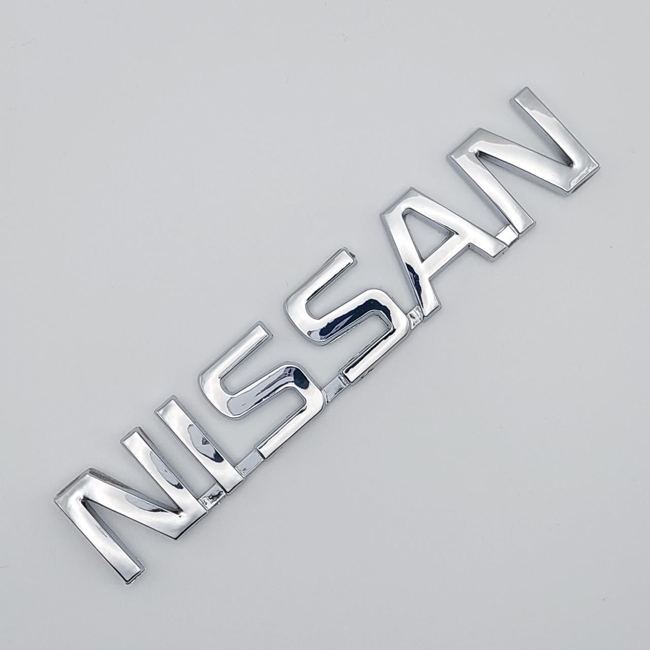 Эмблема надпись Nissan ABS 12х2,2 см Хром глянцевый (1783465867)