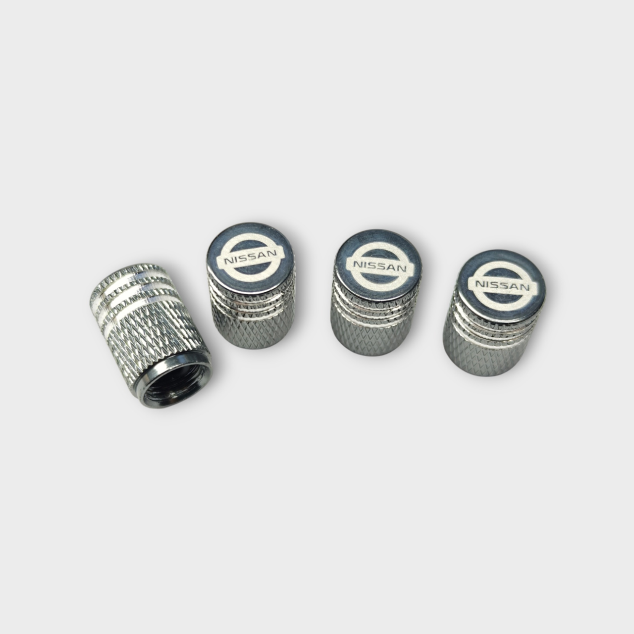 Колпачки на ниппель с логотипом Nissan металлические (2399838394)