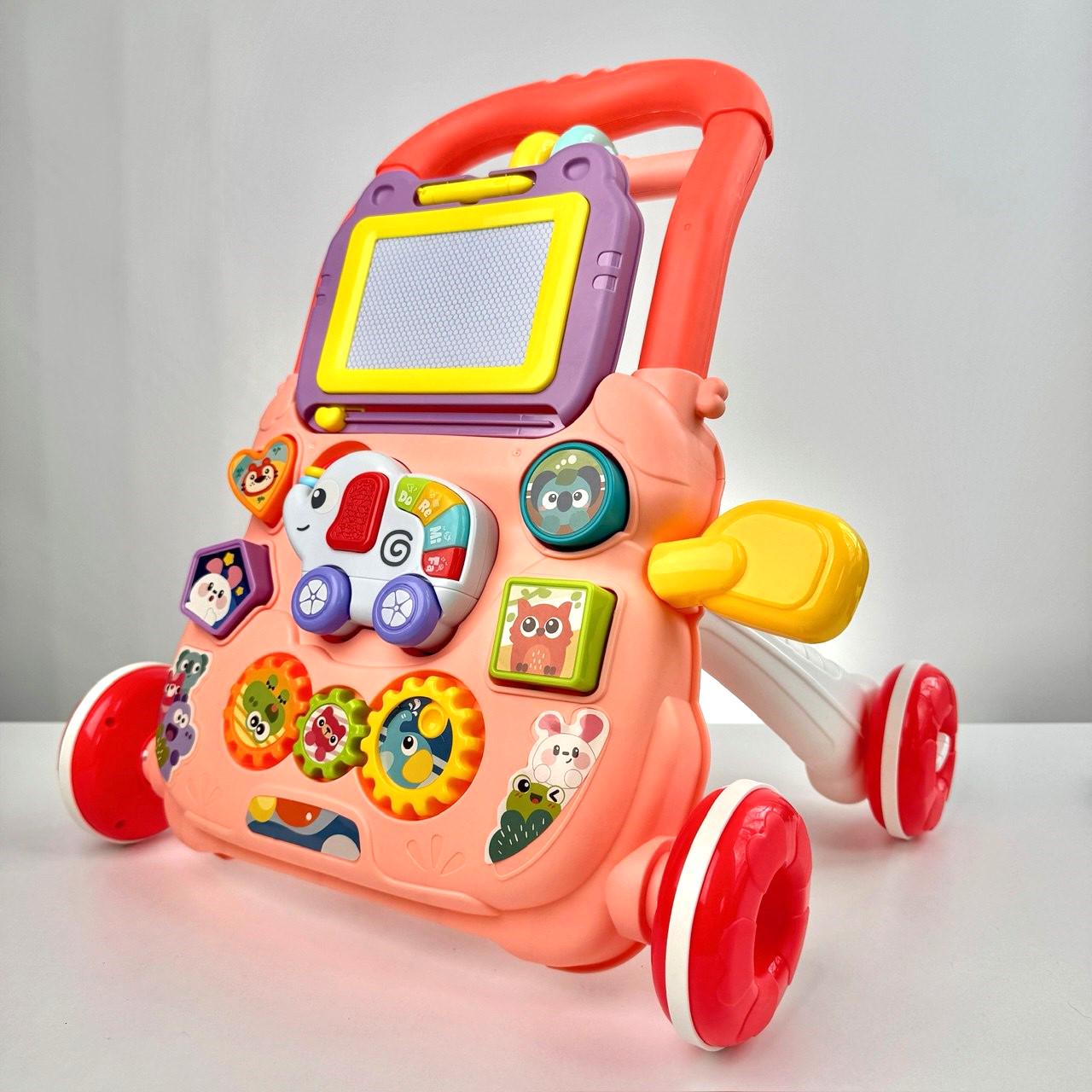 Ходунки детские каталка-толокар с бизибордом и доской для рисования Розовый (29438607)