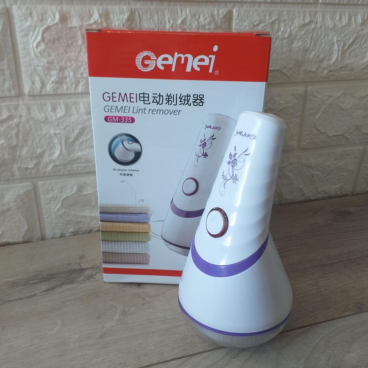 Машинка аккумуляторная Gemei GM-335 для удаления катышек с поворотной ручкой Белый с фиолетовым (KG-10278) Машинка аккумуляторная Gemei GM-335 для удаления катышек с поворотной ручкой Белый с фиолетовым (KG-10278)