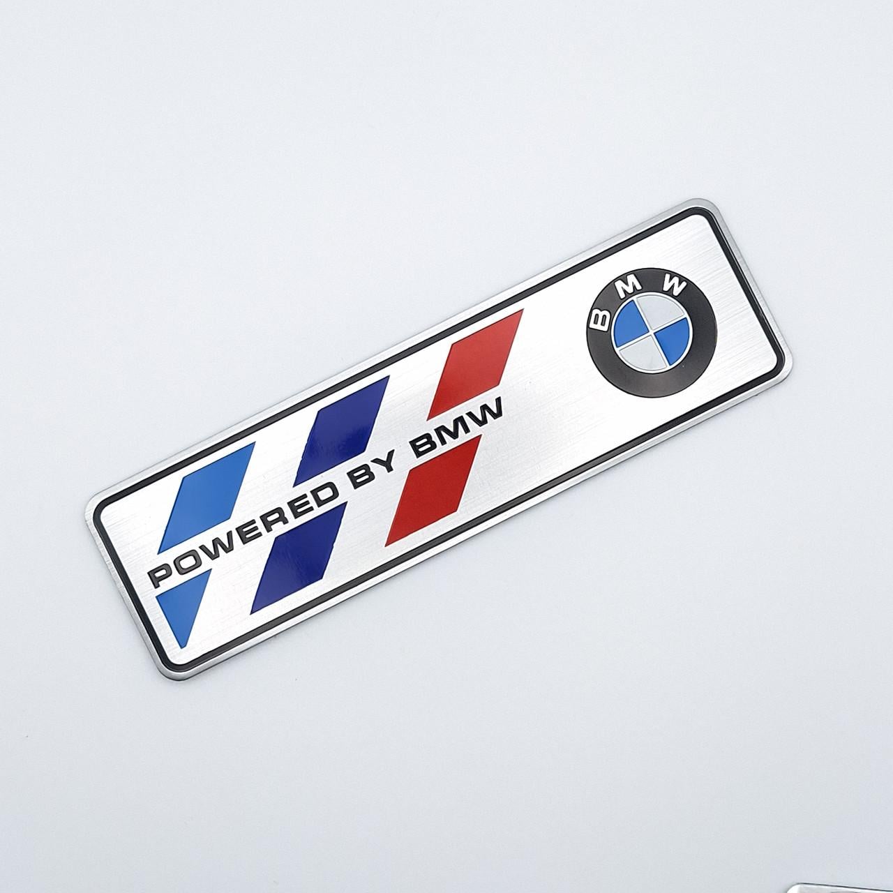 Емблема алюмінієва Powered by BMW 12х3,5 см Хром (2013619502)