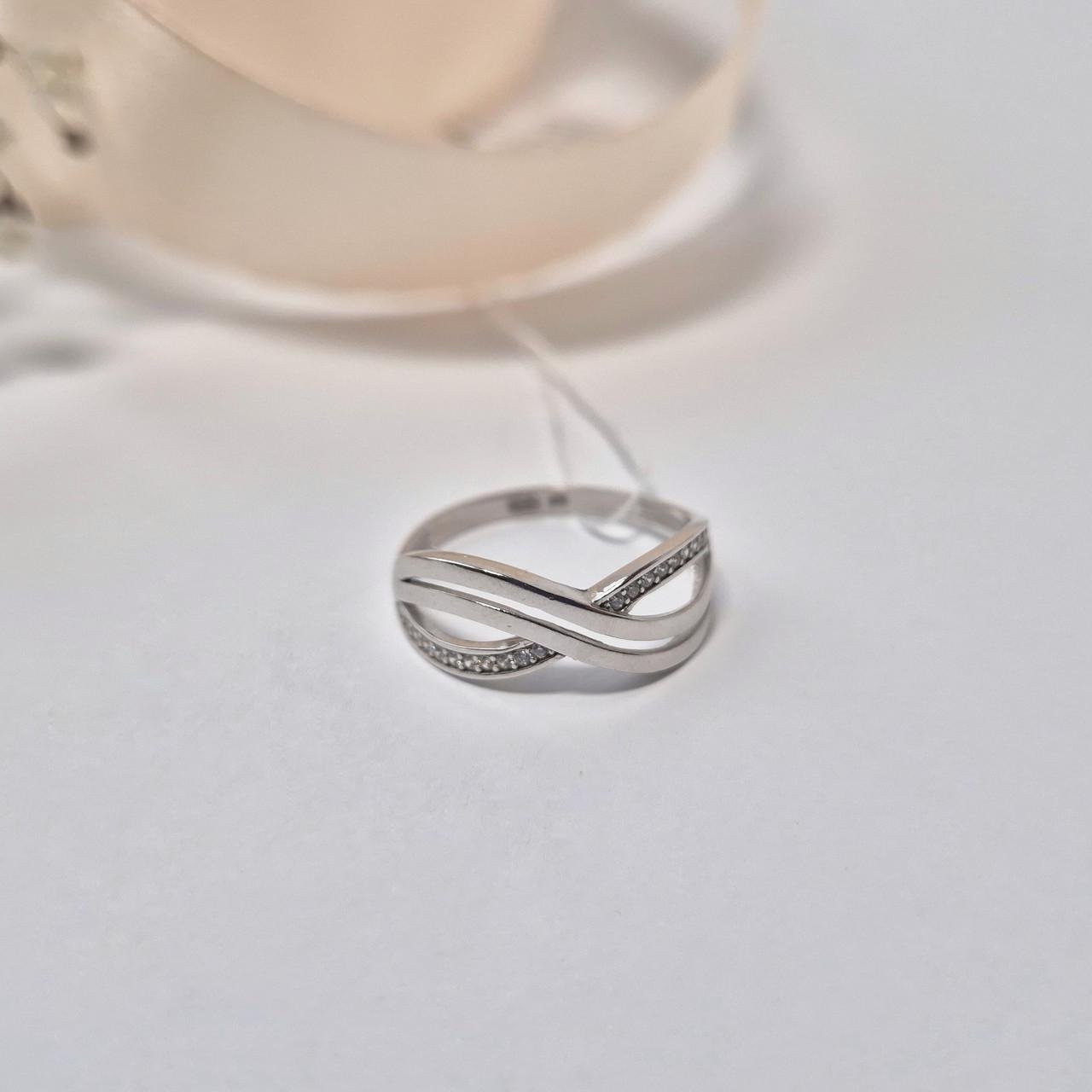 Каблучка з білими каменями нескінченність срібло 925 проби родоване р. 19.0 - фото 1 Каблучка з білими каменями нескінченність срібло 925 проби родоване р. 19.0 - фото 1