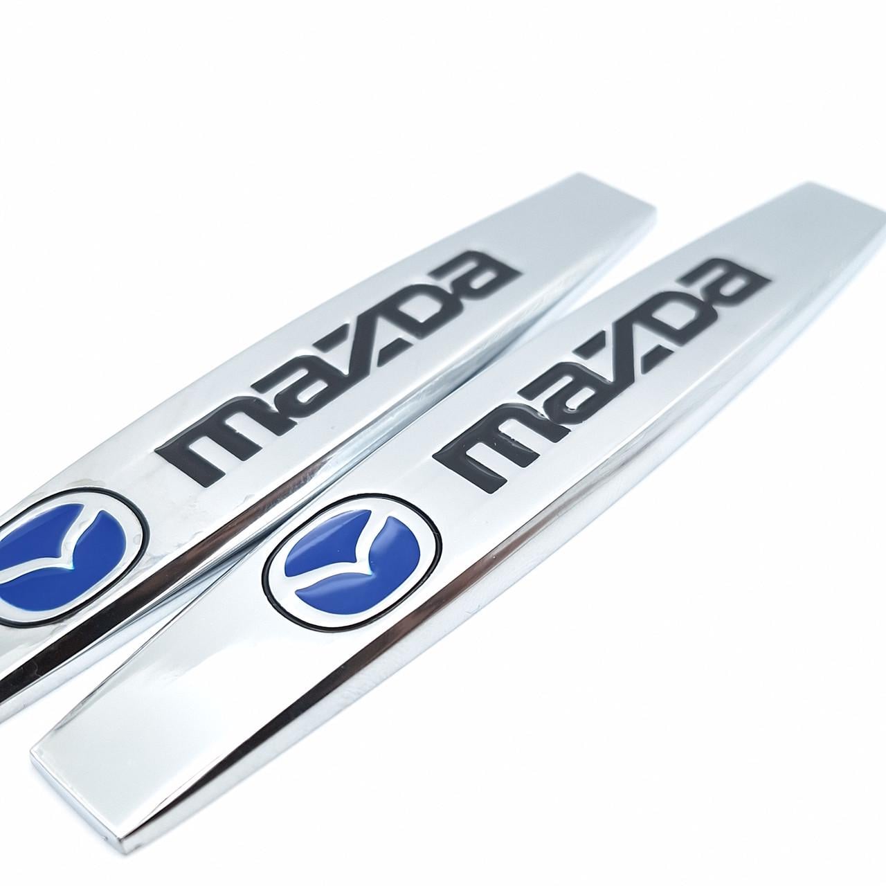 Эмблема на крылья Mazda 10х1,8 см Хром глянцевый (1996615364)
