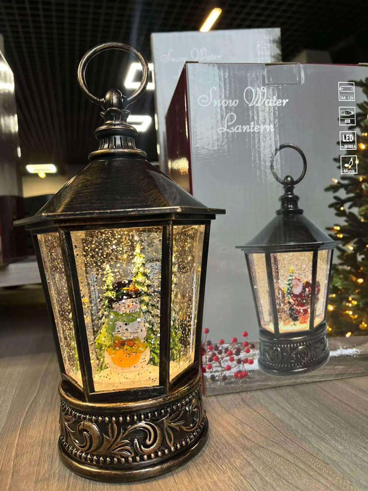 Фонарь музыкальный новогодний Снеговик XMAS WDL 24077A от 3 батареек АА или сети 220V с подсветкой и вьюгой 14х22х14 см