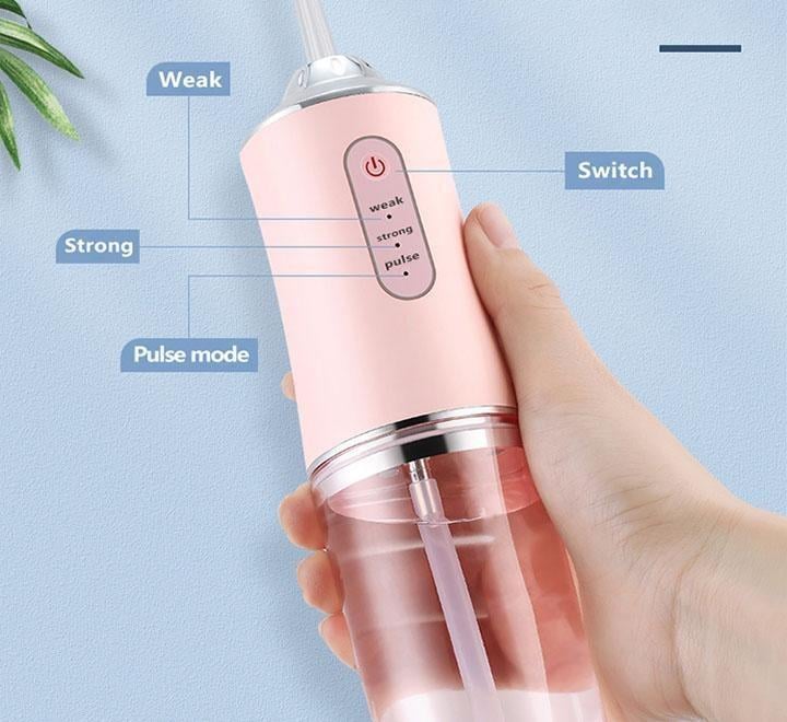 Іригатор для порожнини рота портативний Portable Oral Irrigator з 4 насадками Рожевий - фото 3