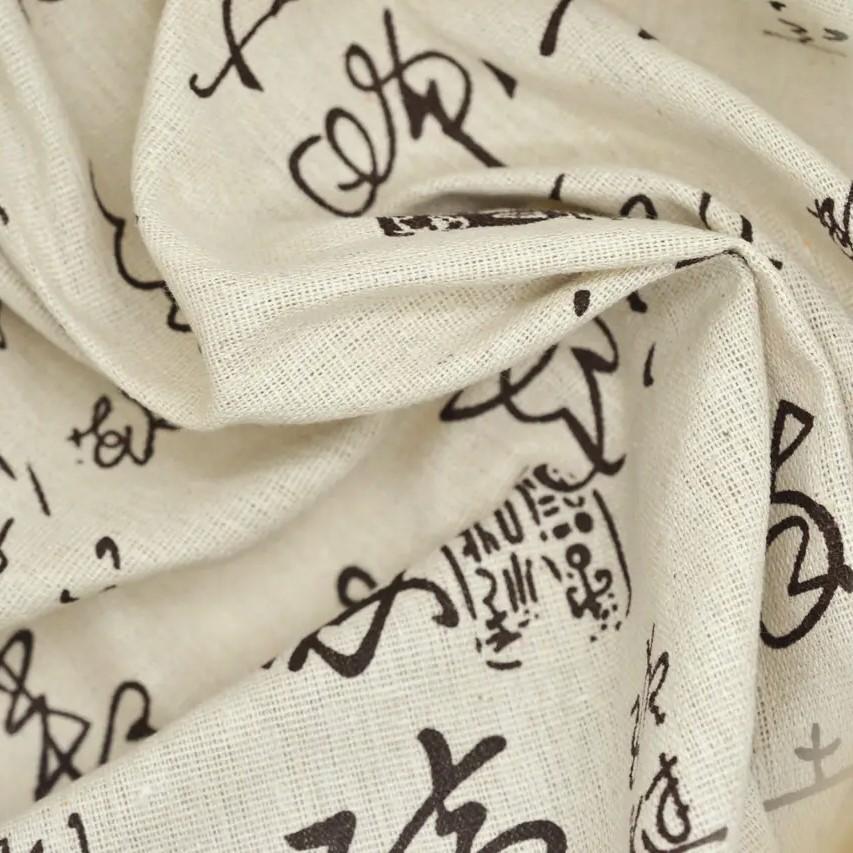 Тканина для рукоділля з чорними написами 150x100 см 55% льон 45% бавовна Бежевий (ТП1510р01)