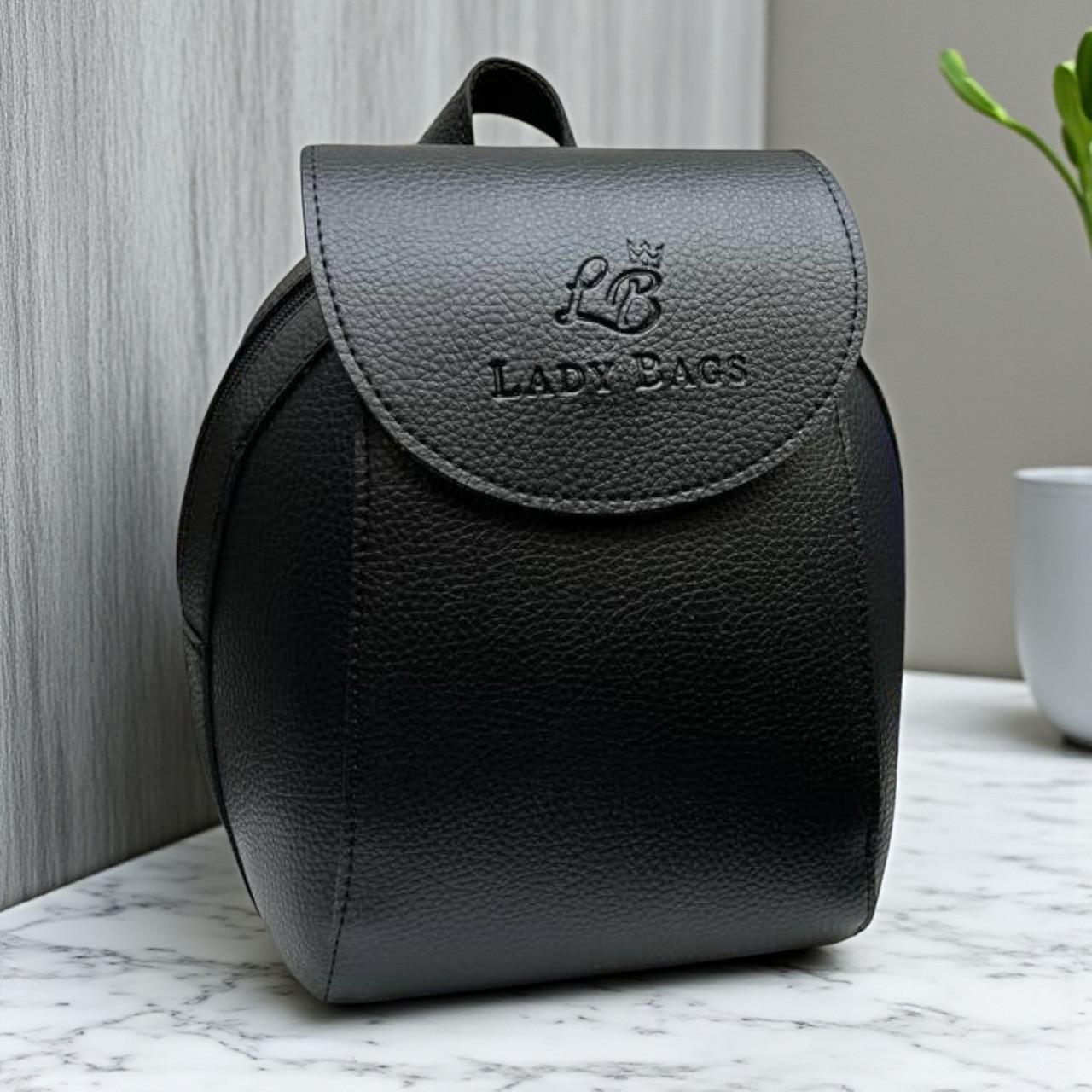 Рюкзак-трансформер через плечо городской под клапаном 25х19 см Черный Рюкзак-трансформер через плечо городской под клапаном 25х19 см Черный