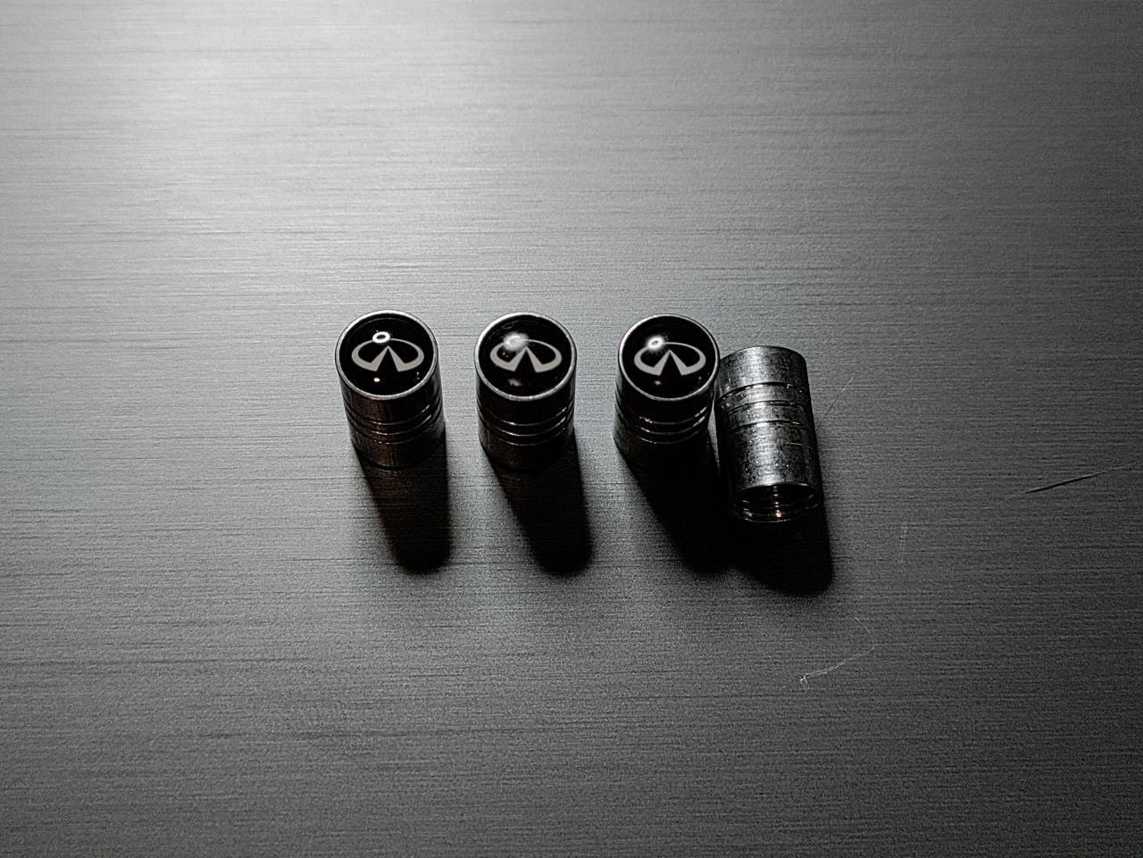 Колпачки на ниппель с логотипом INFINITI металлические (1932684584) Колпачки на ниппель с логотипом INFINITI металлические (1932684584)