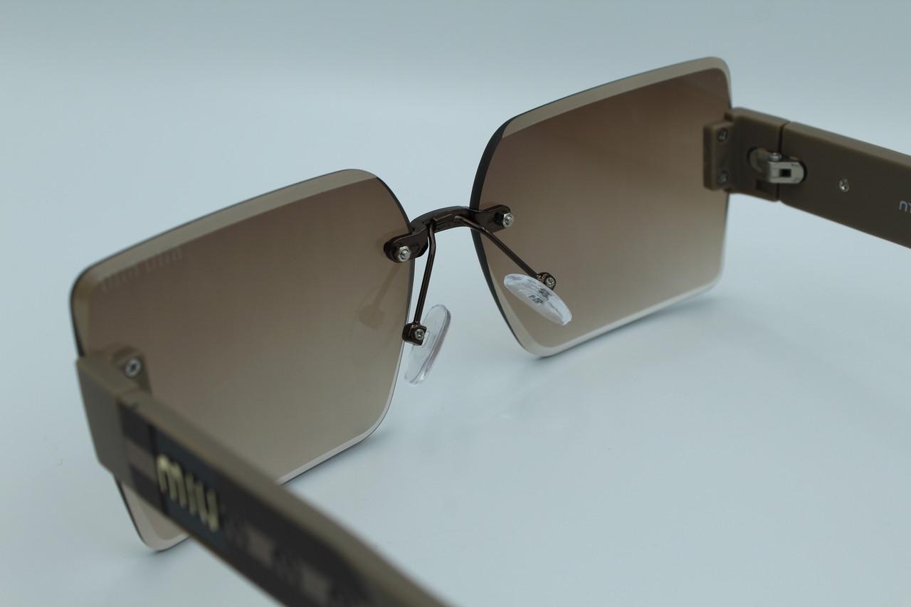 Сонцезахисні окуляри жіночі дизайнерські (58094 №1) - фото 8 Сонцезахисні окуляри жіночі дизайнерські (58094 №1) - фото 8