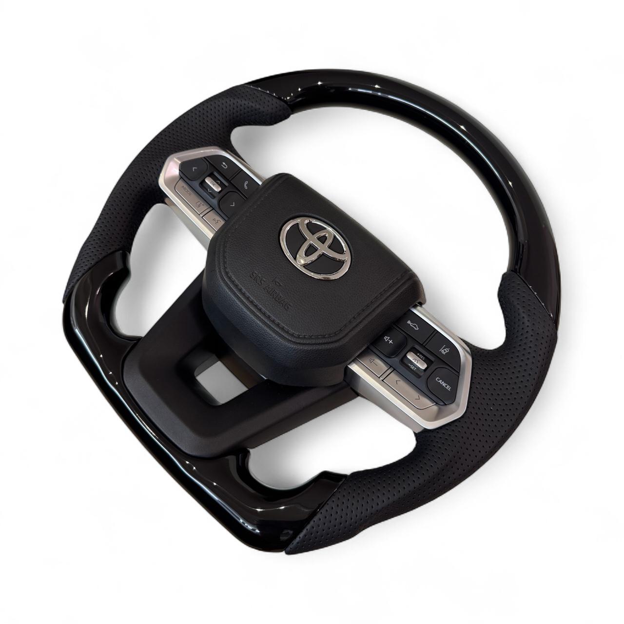 Руль для Toyota Land Cruiser 100/Prado 120 рояльный лак со скошенным низом логотип и кнопки хром (29014242) - фото 5 Руль для Toyota Land Cruiser 100/Prado 120 рояльный лак со скошенным низом логотип и кнопки хром (29014242) - фото 5