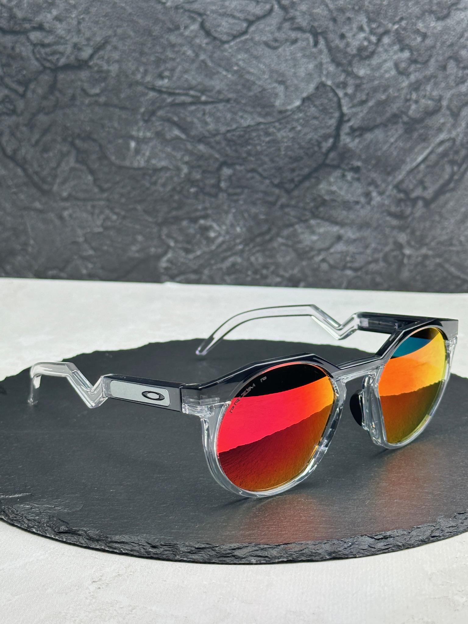 Солнцезащитные очки Oakley HSTN OO9242 круглые с линзой Prizm Ruby поляризованные зеркальные Прозрачный
