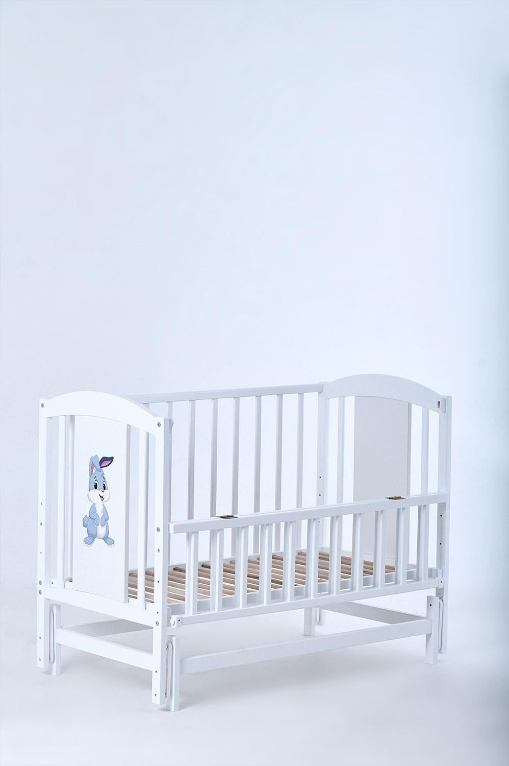 Кроватка для новорожденных деревянная Лилия с маятником 120-60 см White (Kuz65)