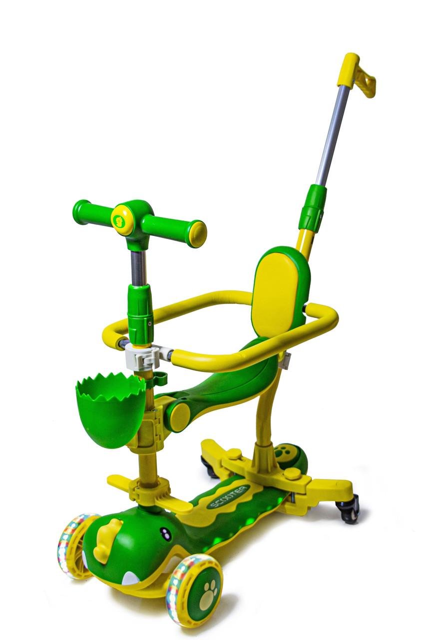 Біговіл триколісний з бортиком Dinosaur 5в1 з музикою та підсвічуванням Зелений Біговіл триколісний з бортиком Dinosaur 5в1 з музикою та підсвічуванням Зелений