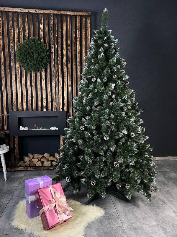 Штучна ялинка засніжена Астель з шишками 2,2 м Зелений (YNK081731) - фото 1 Штучна ялинка засніжена Астель з шишками 2,2 м Зелений (YNK081731) - фото 1