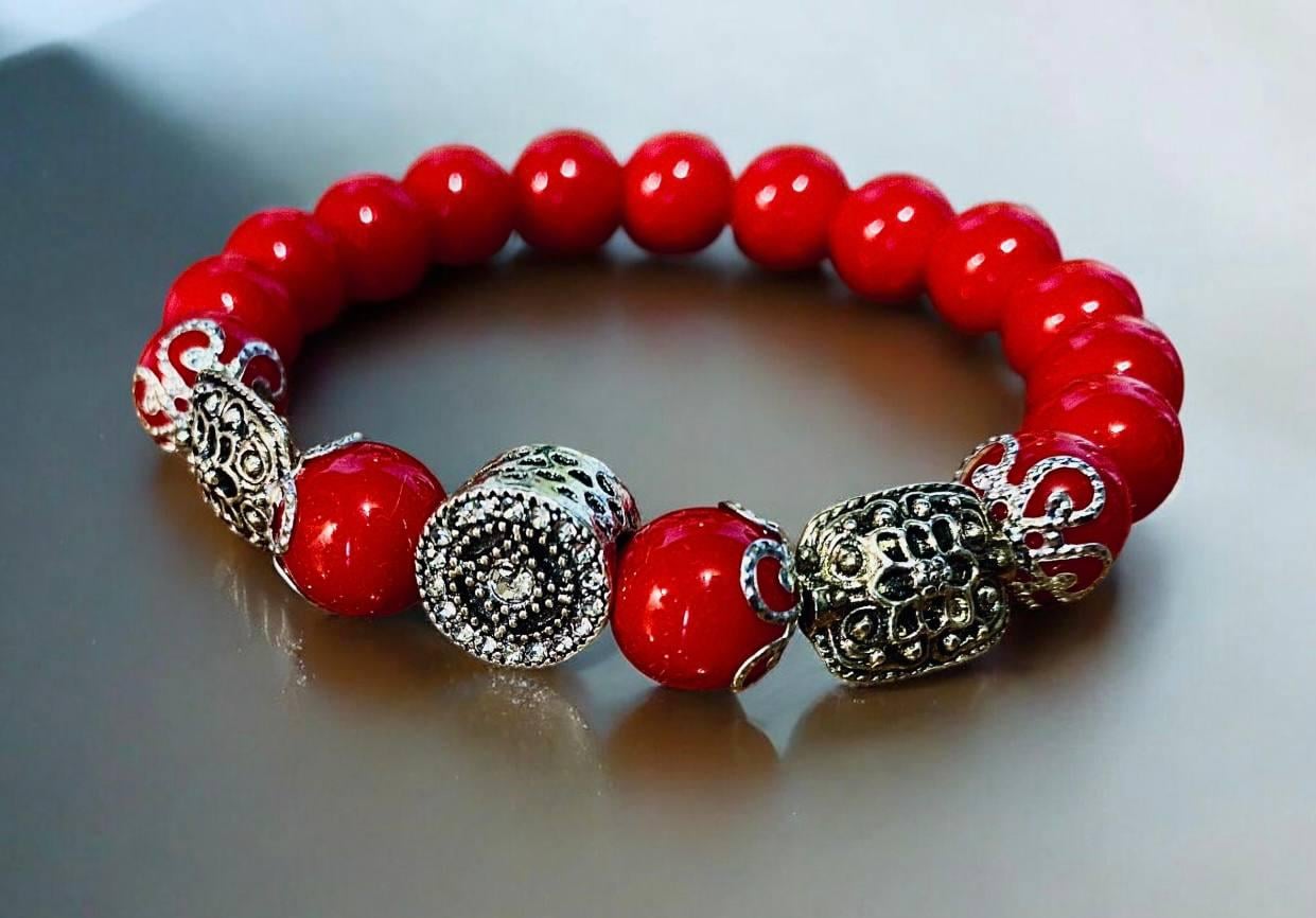 Браслет LITAURS натуральне каміння корал d 10 мм металеві вставки М 15-17 см (260311)