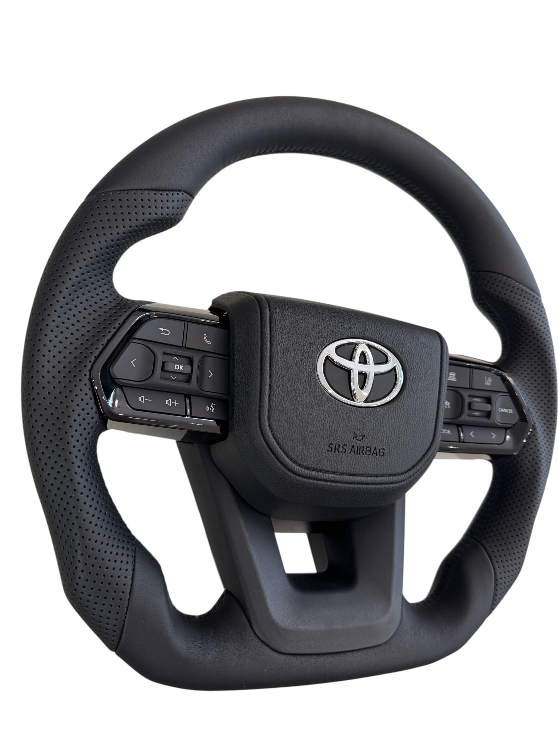 Руль для Toyota Land Cruiser 200 Prado 150 Без подогрева кожа со скошенным низом логотип хром (29342176) - фото 4 Руль для Toyota Land Cruiser 200 Prado 150 Без подогрева кожа со скошенным низом логотип хром (29342176) - фото 4