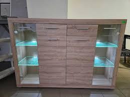 Комод в гостиную с подсветкой ВМК БРВ Элия KOM2D2S2W Дуб Сонома (GRB-1518) - фото 2 Комод в гостиную с подсветкой ВМК БРВ Элия KOM2D2S2W Дуб Сонома (GRB-1518) - фото 2