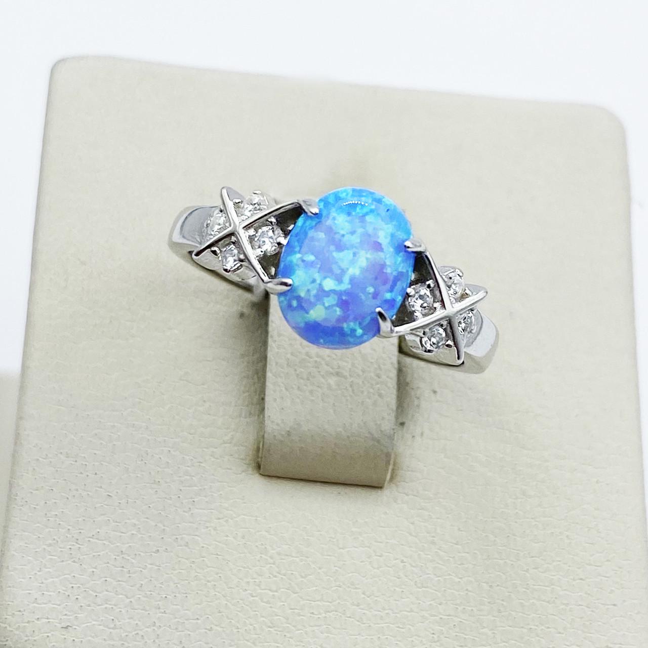 Кольцо серебряное с голубым опалом р. 17,5 2,27 г (1910474172)