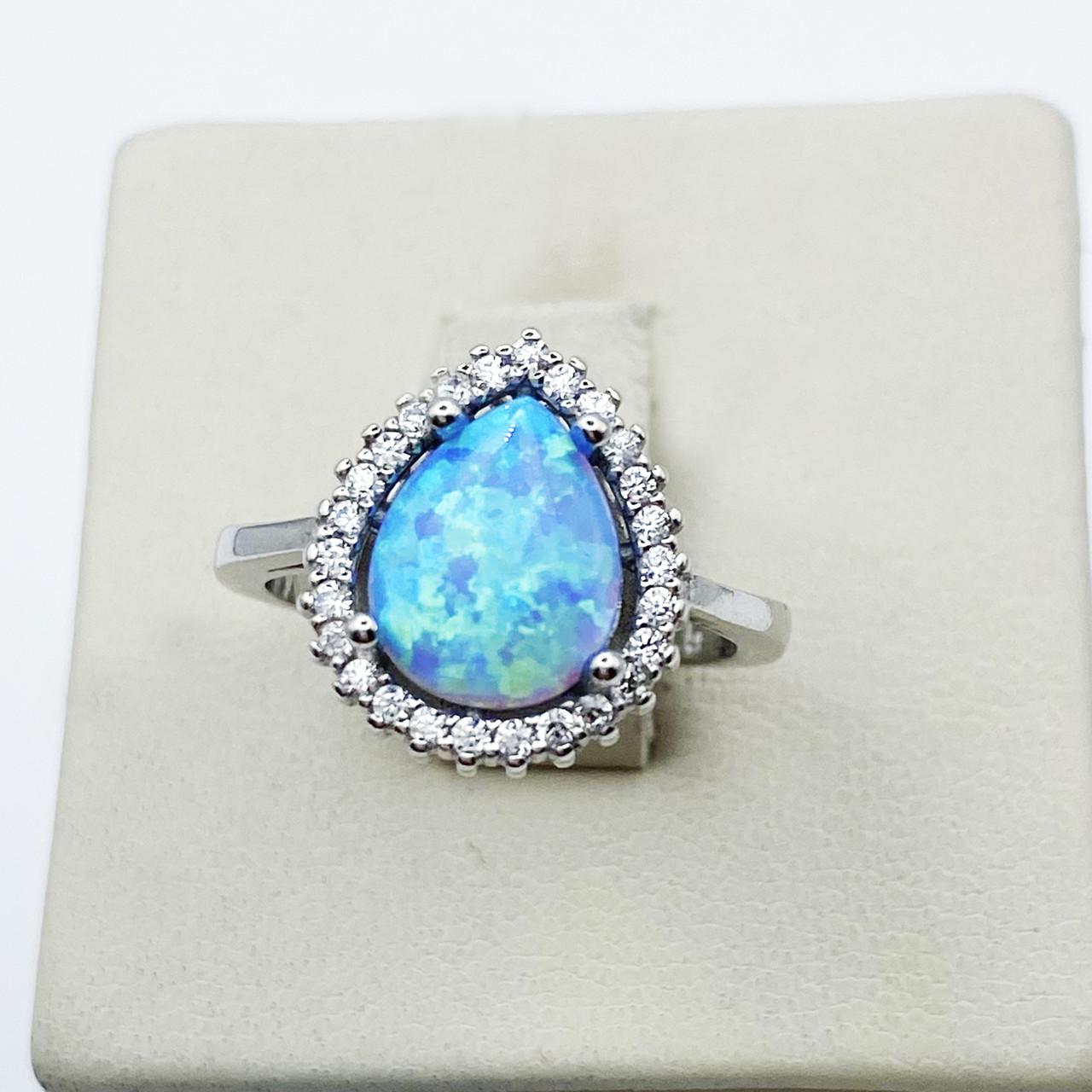 Кольцо серебряное с голубым опалом р. 17 3,09 г (1898822961)