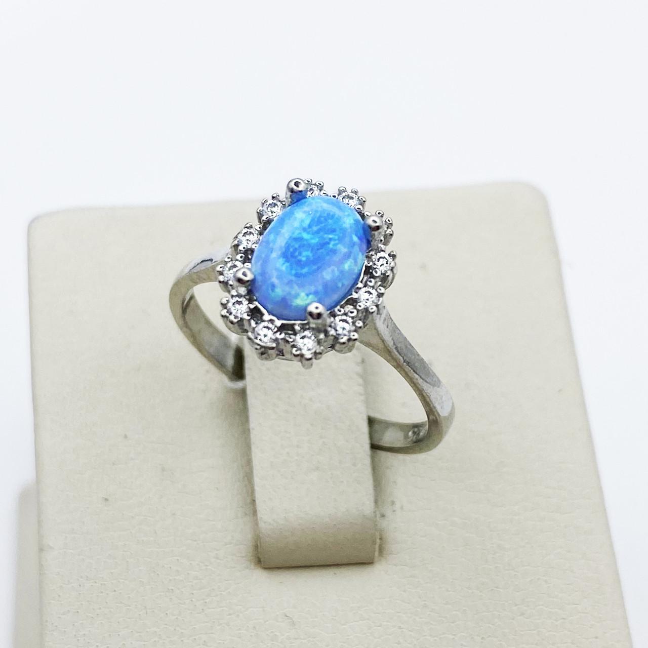 Кольцо серебряное с голубым опалом р. 18 2,28 г (1899103572)