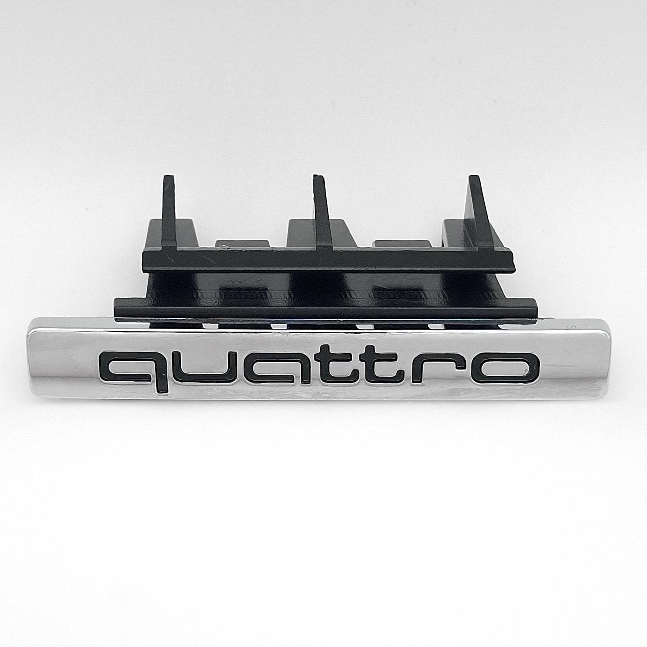 Эмблема радиаторной решетки Quattro Audi 75х10 мм Хром/Черный (8KO 853 736 B A4 B8 A6 C7)