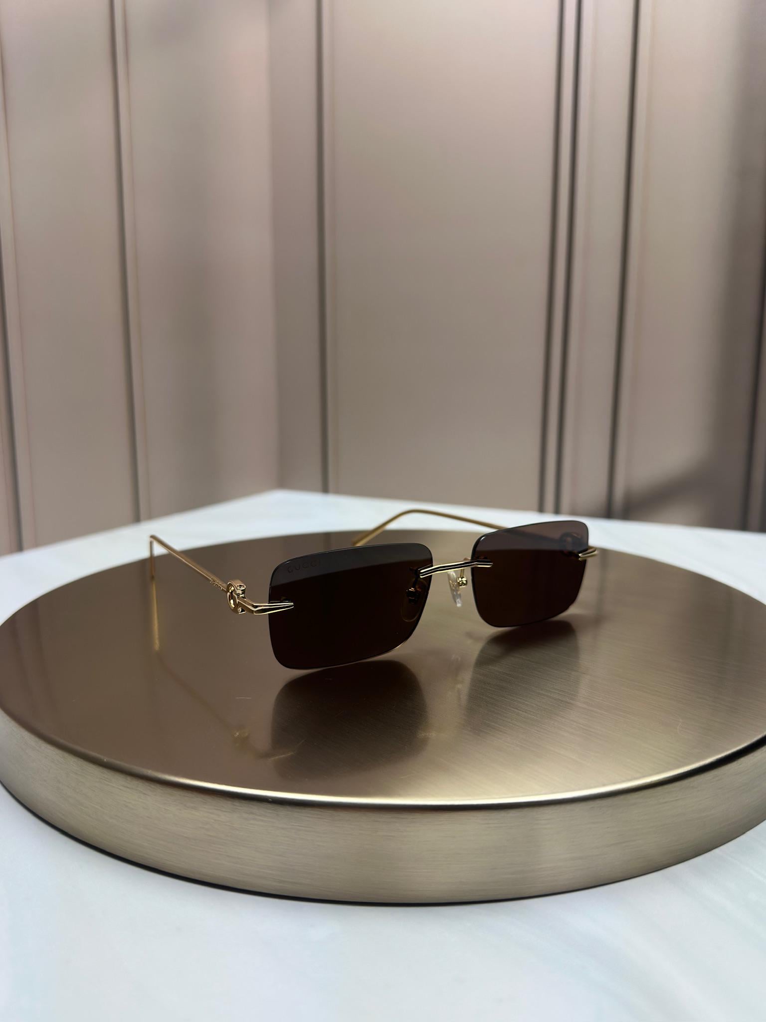 Солнцезащитные очки Gucci GG1703S безободочная прямоугольная оправа коричневая линза Золотой
